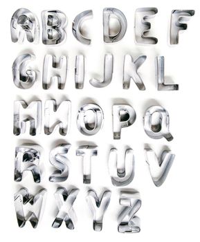 cookie cutter letters isolated on a white background.