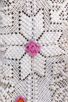 Close up view of a beautiful portuguese embroidery design with flower motifs.