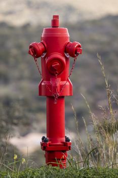 Close view of a Red fire hydrant on the countryside.