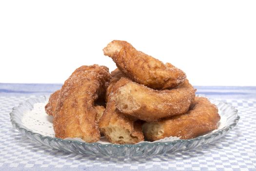 Portuguese Farturas or Spanish Churros, Fried dough sticks on a table cloth.