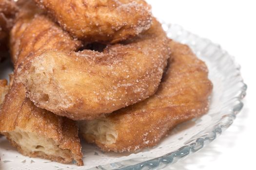 Portuguese Farturas or Spanish Churros, Fried dough sticks isolated on a white background.