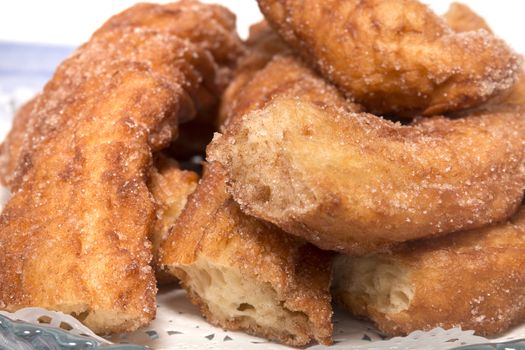 Portuguese Farturas or Spanish Churros, Fried dough sticks on a table cloth.