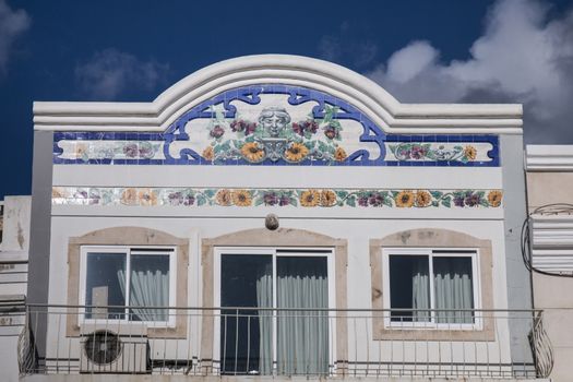 Outdoor view of the main architecture style of buildinds in the Algarve with beautiful azulejo artwork.