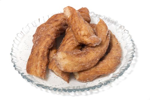 Portuguese Farturas or Spanish Churros, Fried dough sticks isolated on a white background.