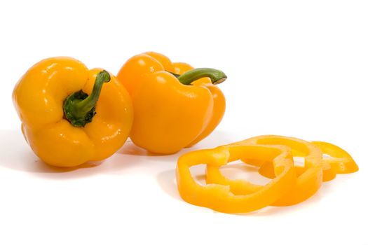 yellow bell peppers isolated on a white background.