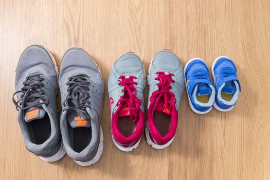 Three pairs of sneakers for the whole family, dad, mom and child.