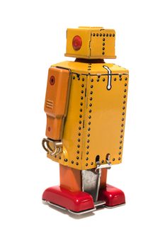 Vintage tin robot toy isolated on a white background.