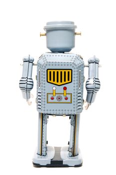 Vintage tin robot toy isolated on a white background.