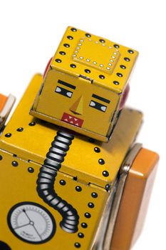 Vintage tin robot toy isolated on a white background.