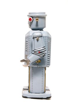 Vintage tin robot toy isolated on a white background.