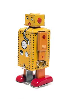 Vintage tin robot toy isolated on a white background.