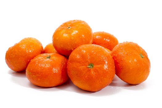 Wet clementines fruits isolated on a white background.