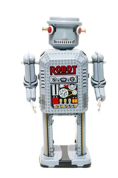 Vintage tin robot toy isolated on a white background.