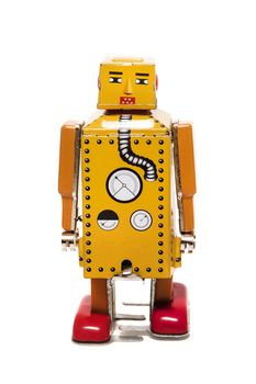 Vintage tin robot toy isolated on a white background.