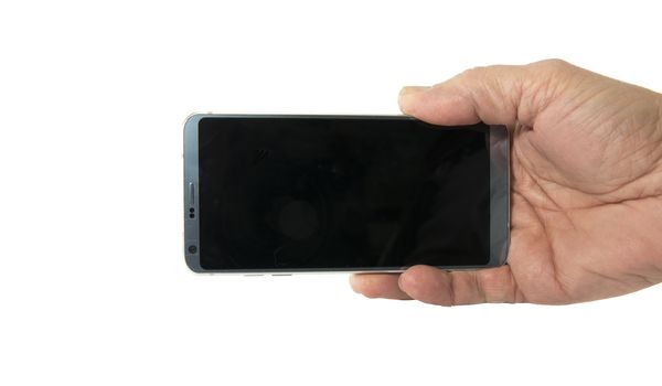 male hand with mobile phone isolated on white background