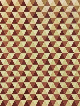 Retro style geometric wallpaper in brown and yellow tones.