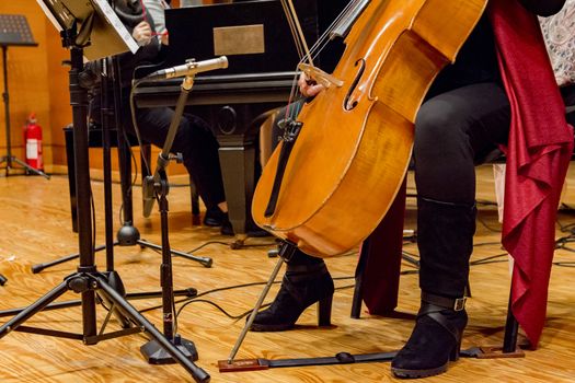 young woman plays cello