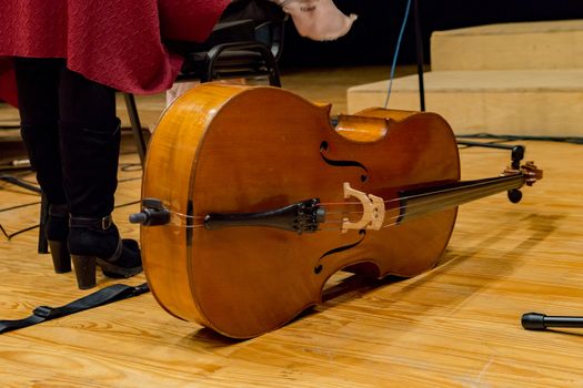 one cello on the floor before concert begins