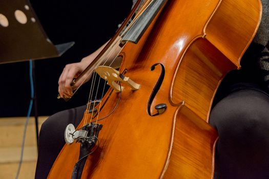 young woman plays cello