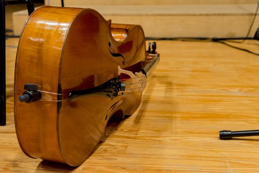 one cello on the floor before concert begins