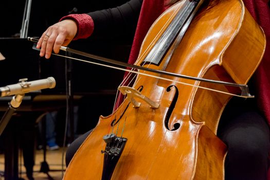 young woman plays cello