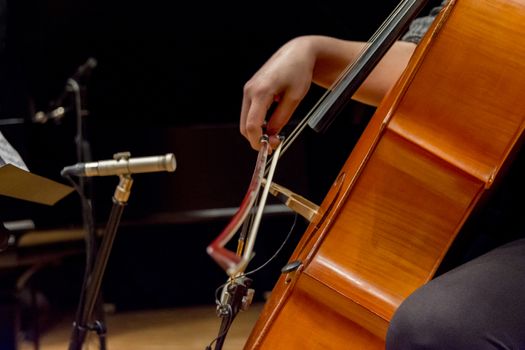 young woman plays cello