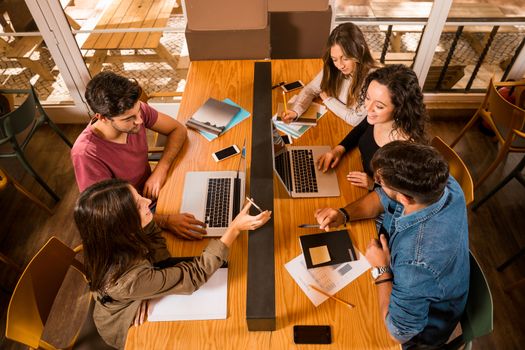 Groups of friends studying together on the bibliotech