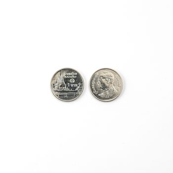 Front and rear of a Thai coin from 1 Bath on a white surface