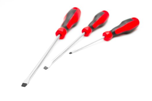 Three chisel screwdrivers on a white background.