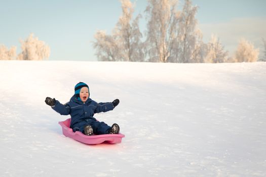 The boy has fun on a cold winter day.