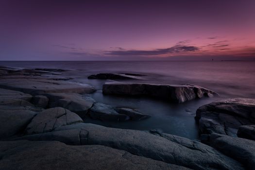 A sunset image in which the sky is colored in purple color.