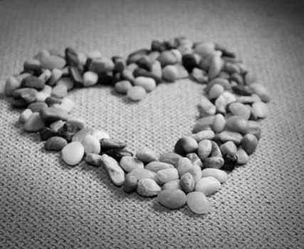 Small stones in the heart shape. The picture is black and white.