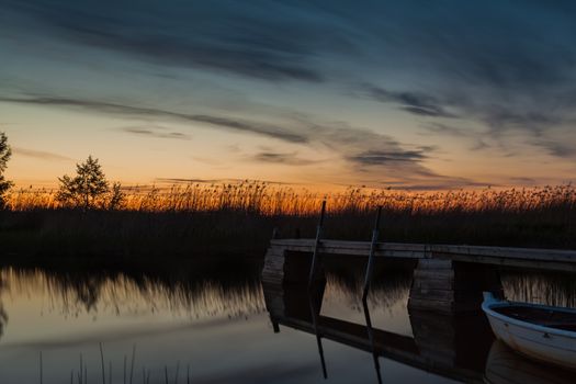 Beautiful sunset picture in Pori, Finland. The water is calm.