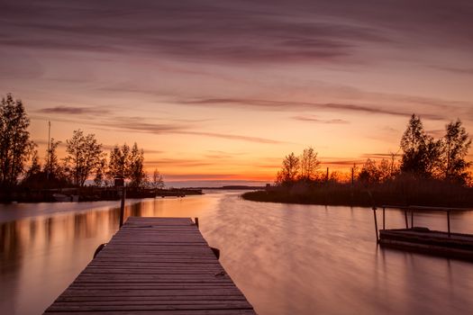 Beautiful sunset picture. The picture also has a dock.