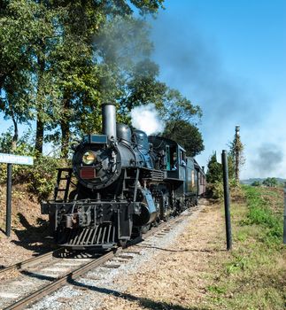 Steam Engine Locomotive on a Warm Cloudless Sunny Summer Day Sightseeing Amish Farm Land