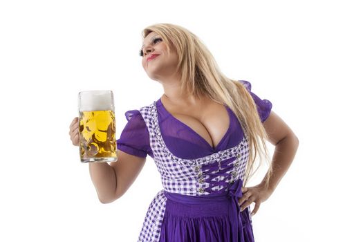 bavarian woman in a dirndl with beer