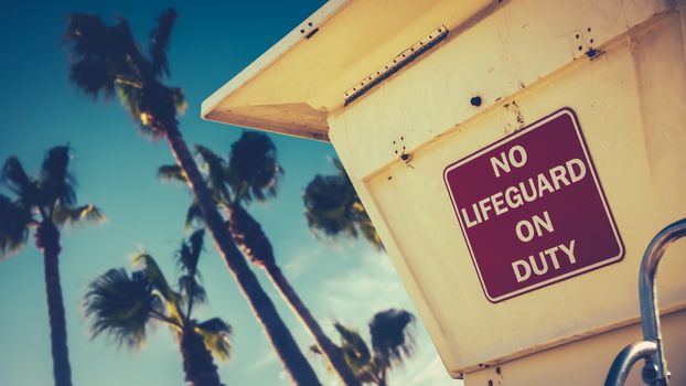 Retro Image Of A Lifeguard Station Or Tower On A Beach In California With Palm Trees