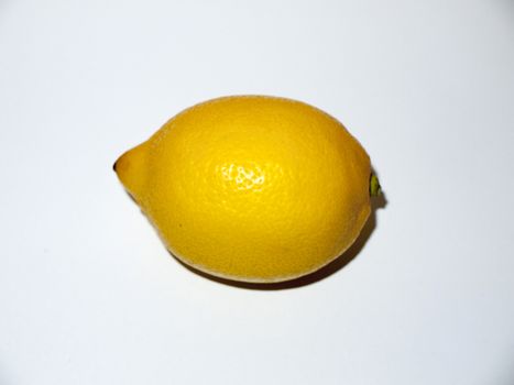 yellow lemon close up texture skin fruit white background food studio; essex; england; uk