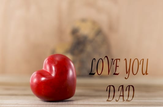 Happy fathers day red heart shape with text love you dad