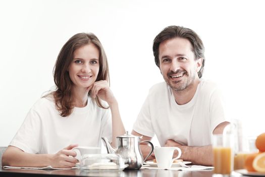 Couple having breakfast together, isolated on white background