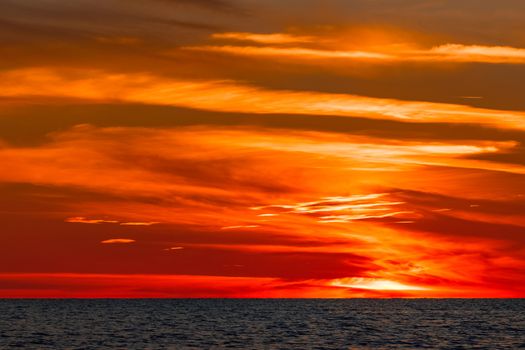 Hot and romantic sunset over the Baltic sea. Calm landscape