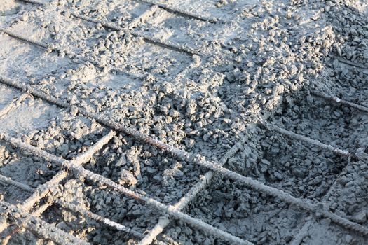 Closeup shot of construction site reinforcing metal bars of industrial floor