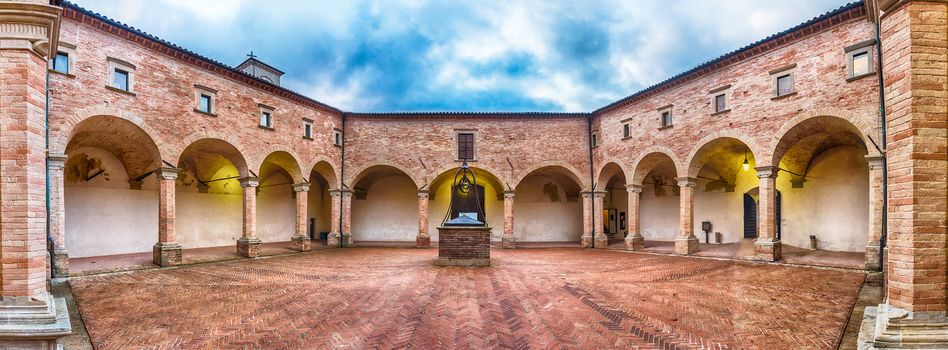 Panoramic view of the ancient cloister inside the Basilica of Saint Ubaldo, a roman catholic church atop Mount Ingino, outside central Gubbio in Umbria, Italy