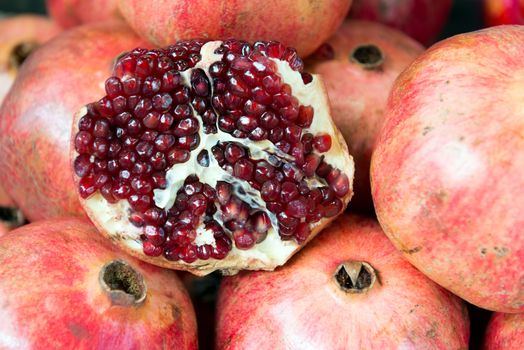 Ripe fresh pomegranate fruit on sales in market