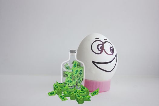 Concept of profit and safety of the deposit. Dollars in bundles and a glass jar with currency. Egg cheerful with face alone on white background concept of flirting. Photo for your design