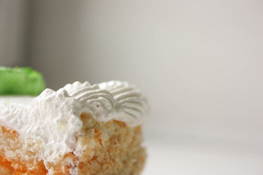 Cake piece. Close up shot on white background. Photo for your design.
