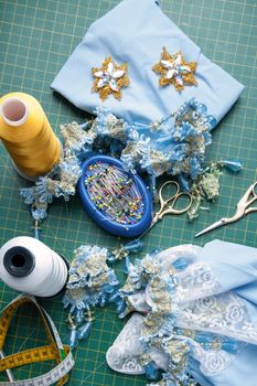 Set for handiwork: Scissors, thread, pins, centimeter, needles, ornaments