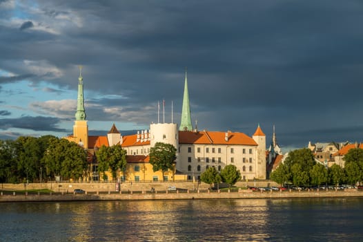 Fantastic view of the Riga Castle from the riverside in a summer evening