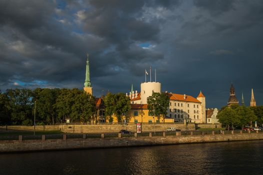 Fantastic view of the Riga Castle from the riverside in a summer evening