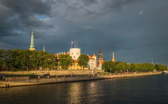 Fantastic view of the Riga Castle from the riverside in a summer evening